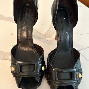 Black leather peep toe heels with buckle
